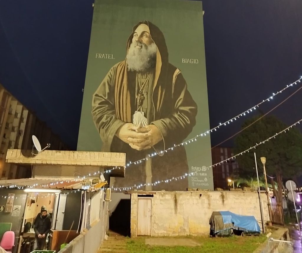 Sinergia Amg Energia-Comune Palermo, illuminato murale di Biagio Conte